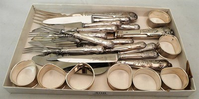 Lot 408 - Set of eight silver napkin rings and silver-handled cutlery