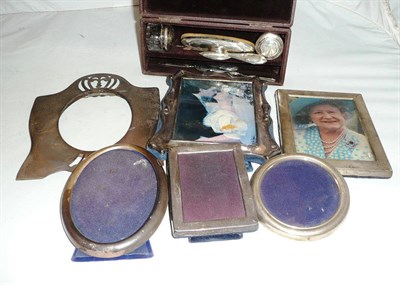 Lot 409 - Five silver photograph frames, a plated example and a silver backed manicure set - cased (7)