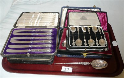 Lot 411 - Four cased sets of silver teaspoons, two sets of silver handled fruit knives and a Roman style...