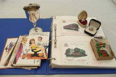 Lot 438 - Silver goblet, medals, two rings, postcards rail history cover album