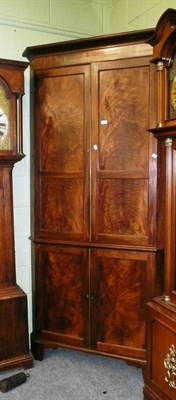 Lot 522 - A large George III mahogany corner cupboard