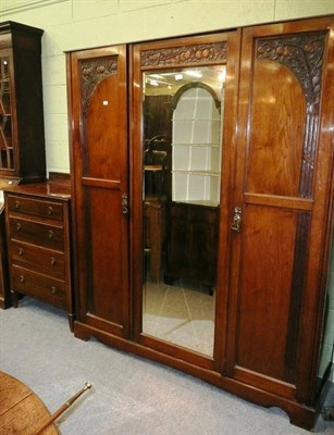 Lot 524 - Arts and crafts walnut triple wardrobe and a walnut four height chest (2)