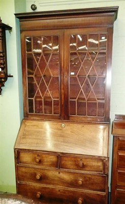 Lot 525 - George III mahogany bureau bookcase