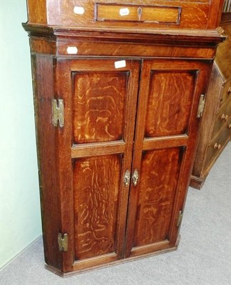 Lot 528 - George III hanging corner cupboard with fluted sides