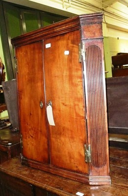 Lot 545 - George III fruitwood corner cupboard