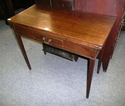 Lot 549 - A 19th century oak fold over tea table