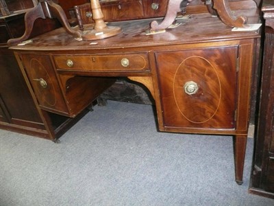 Lot 554 - An Edwardian mahogany bow front dressing table/sideboard