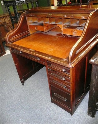 Lot 560 - Roll top desk