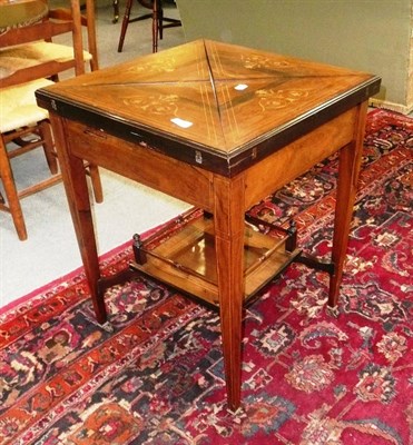 Lot 569 - An Edwardian inlaid rosewood envelope card table