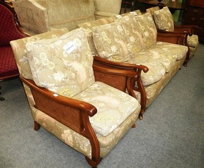 Lot 585 - Three piece walnut bergere suite