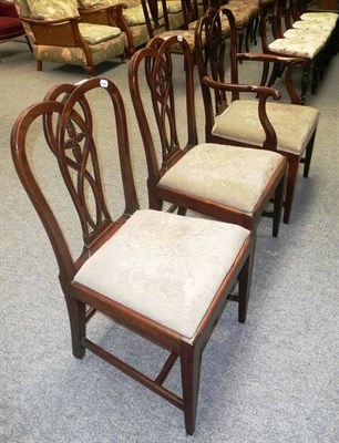 Lot 595 - Two Georgian carved mahogany chairs and a similar elbow chair (3)