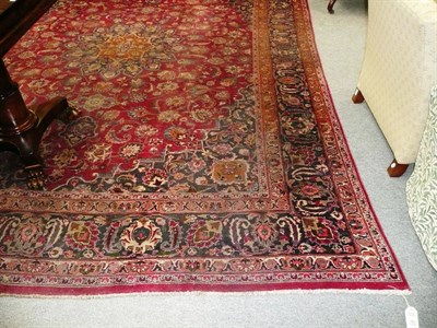 Lot 601 - A Persian red ground carpet