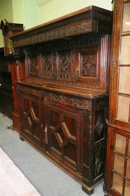 Lot 644 - Carved oak press cupboard