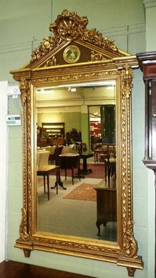 Lot 652 - Gilt over mantle mirror with shell pedinent