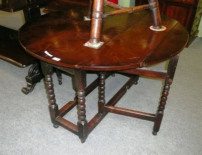 Lot 656 - 18th Century drop leaf table on bobbin legs