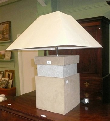 Lot 661 - A cream suede covered electric table lamp