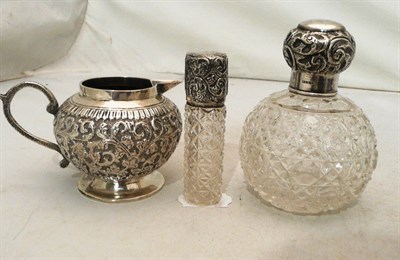 Lot 53 - Silver-mounted cut-glass scent bottle, silver-mounted scent bottle and an Indian white metal jug