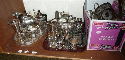 Lot 76 - Two shelves of plated ware including tea service, tray, flatware and a mahogany canteen