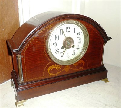 Lot 77 - An inlaid striking mantel clock