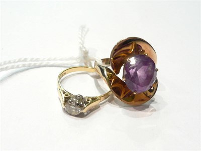Lot 99 - A single stone diamond ring and an amethyst ring (2)