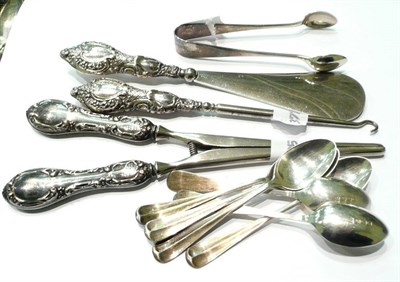 Lot 104 - Set of six silver coffee spoons, silver sugar tongs, a silver-mounted glove stretcher, shoe...
