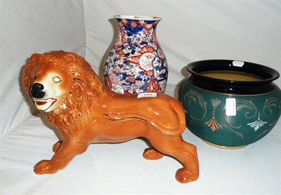 Lot 120 - An Imari vase, a Langley jardiniere and a Staffordshire lion (missing an eye)