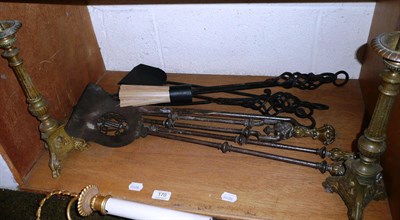 Lot 170 - Two sets of fire irons (one with stand), two spark guards and two candlesticks