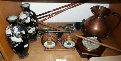 Lot 173 - A shelf of ornamental items including a combined aneroid barometer and timepiece in a walnut...