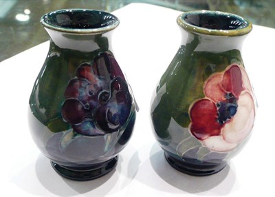 Lot 181 - Two Walter Moorcroft 'Anemone' miniature vases on green grounds