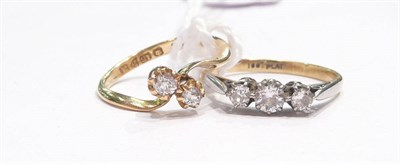Lot 185 - An 18ct gold two stone twist ring and a diamond three stone ring stamped '18CT' and 'PLAT'