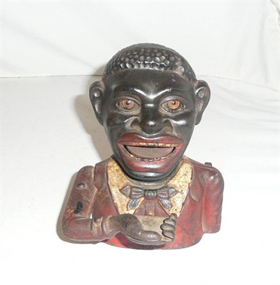 Lot 243 - A 'Jolly Nigger' money bank