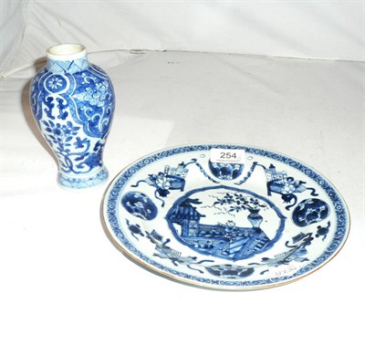 Lot 254 - A Kang Hsi blue and white porcelain small vase, lacks cover and a Chien Lung plate (a.f.) (2)