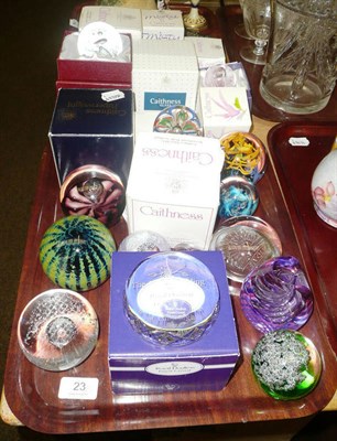 Lot 23 - Fourteen Caithness paperweights on two trays