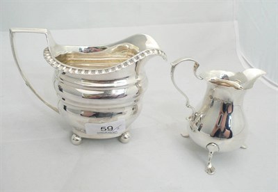 Lot 59 - A silver cream jug and another, 10oz approximate weight