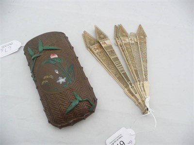 Lot 67 - A Chinese pierced ivory fan and a Japanese wall pocket