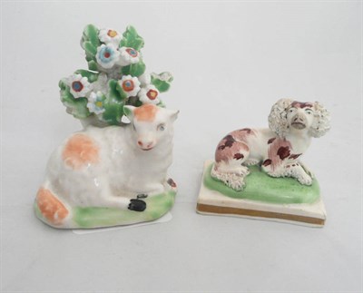 Lot 72 - A Derby porcelain figure of a lamb and a similar figure of a spaniel