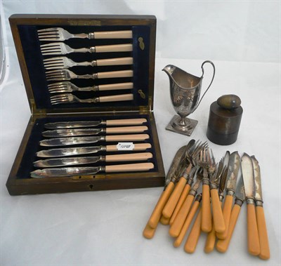 Lot 77 - A silver cream jug, London 1794, a boxed set of fish knives and forks, another set, sewing kit...