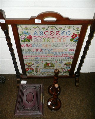 Lot 108 - Oak framed fire screen with sampler insert dated 1874, pair of candlesticks and a Victorian album