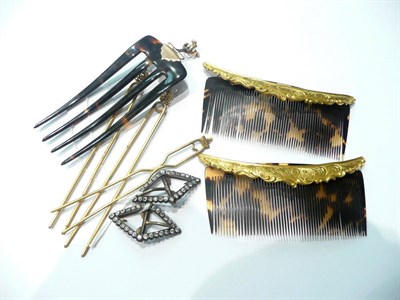 Lot 114 - Two tortoiseshell hair combs, another with screw fitting, three hair pins and a pair of paste...