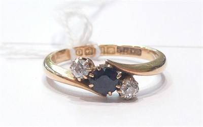 Lot 154 - An 18ct gold sapphire and diamond ring
