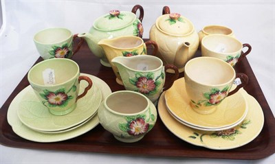 Lot 158 - A Carlton Ware green leaf moulded tete a tete and another example in yellow