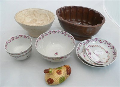 Lot 169 - A Newhall type sugar bowl, two tea bowls and saucers, two jelly moulds and a bird money box