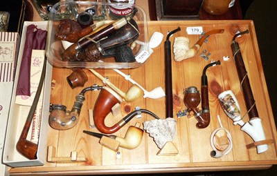 Lot 179 - A collection of smokers pipes including Meerschaum Turks head, clay Bacchus, carved briars, a...