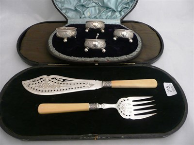 Lot 215 - A cased four piece cruet set and a cased fish knife and fork