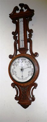 Lot 232 - A Victorian aneroid barometer/thermometer in an oak banjo case