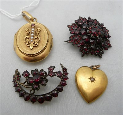 Lot 250 - A French gold locket, two garnet brooches and a pendant