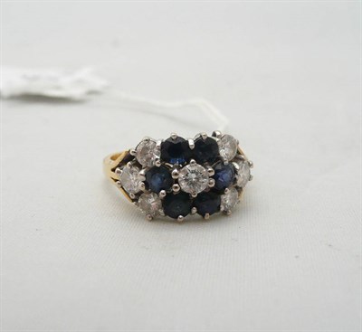 Lot 251 - A diamond and sapphire thirteen stone ring