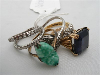 Lot 264 - A gold diamond set ring, a 9ct gold ring set with a blue stone and four other rings