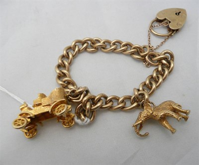 Lot 274 - A 9ct gold bracelet with two charms, 43g