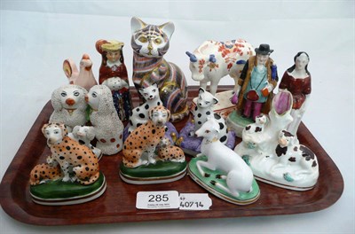 Lot 285 - A Royal Crown Derby cat paperweight, two small pairs of figures of dogs, a similar pair of...